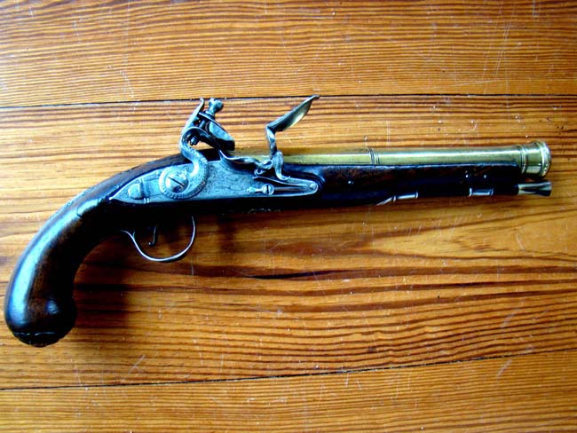 A Revolutionary War period silver mounted brass barreled flintlock Naval officer's pistol